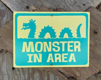 MONSTER IN AREA Sign | Ogopogo | Turquoise and Cream | 13" X 17.5" | Hand-painted and Screen printed on Wood