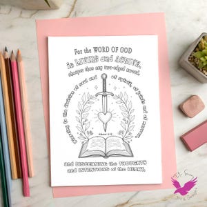 May include: Black and white line art print with the text "For the WORD OF GOD is LIVING and ACTIVE." The image features a sword piercing a heart, surrounded by a wreath, and an open book. The print is on a pink background.