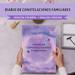 May include: A purple and white journal with a galaxy design and the text "DIARIO DE CONSTELACIONES FAMILIARES" and "VERSION ESPAÑOL + ENGLISH VERSION".