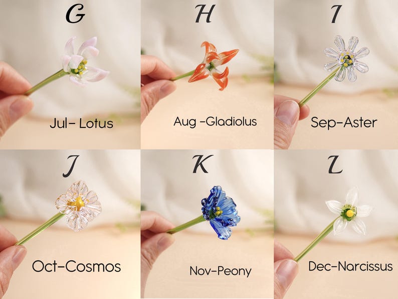 May include: Six glass flower sculptures are displayed, each held by a hand. The flowers are a lotus, gladiolus, aster, cosmos, peony, and narcissus, with months of the year labelled below each flower. Each flower is a different colour.