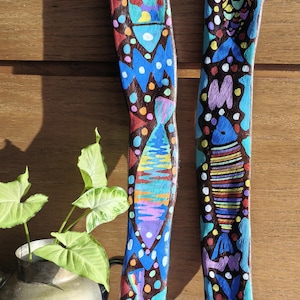 May include: A rustic wooden sign with the text "Welcome to our home" in white lettering. The sign features a distressed finish and a simple, inviting design, perfect for front door decor.