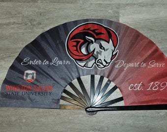 May include: A black and red folding fan with a white ram head logo and the text "Winston-Salem State University", "Enter to Learn", "Depart to Serve", and "est. 1892".