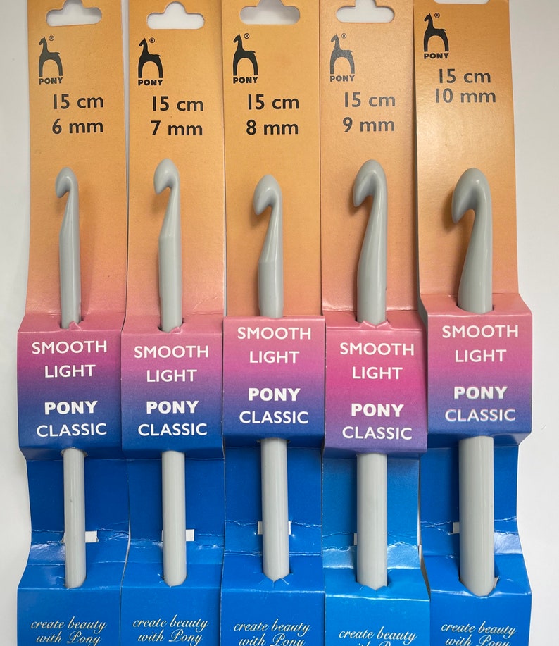 May include: Five gray crochet hooks with the brand name "Pony Classic" and the text "Smooth Light" printed on the packaging. The hooks are labeled with sizes ranging from 6 mm to 10 mm.