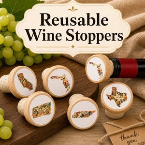May include: Five round cork wine stoppers with wooden tops, each featuring a white circular inlay printed with a floral-patterned map of a U.S. state, including California, Florida, Texas, and Tennessee, displayed alongside green grapes.