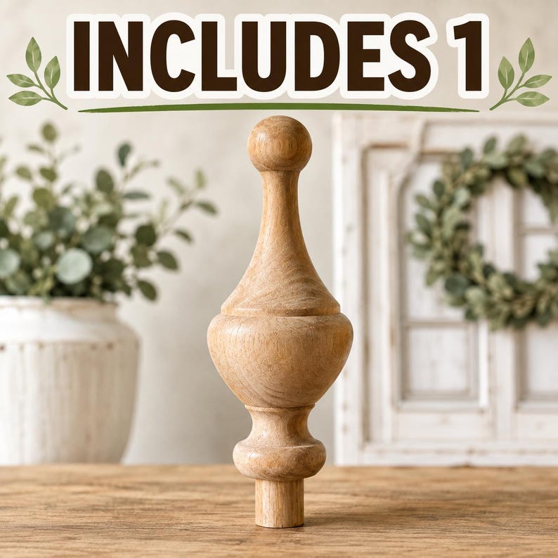 May include: A light brown wooden finial with a smooth, turned silhouette featuring a spherical top, a bulbous middle section, and a cylindrical base. The text INCLUDES 1 is displayed at the top of the image in bold, dark brown capital letters.