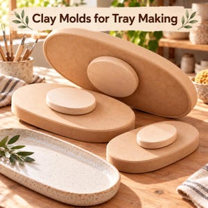 May include: Three oval-shaped light brown wooden clay molds for tray making, each featuring a centered circular handle. The molds are arranged in varying sizes alongside a finished speckled ceramic tray.