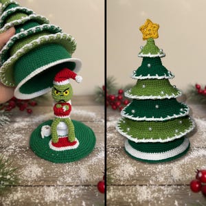 May include: Crocheted Christmas tree decorations. One features a green Grinch figure wearing a Santa hat, emerging from a green tree. The other is a green tree with white trim and pearl accents, topped with a yellow star.