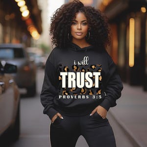 May include: Black hoodie with a leopard print design and the text "i will TRUST PROVERBS 3:5" in white.