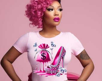 May include: Pink t-shirt with a graphic design of a pink high heel shoe with diamonds and a pink money bag with a dollar sign dripping with pink liquid.