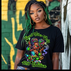May include: Black t-shirt featuring a green, yellow and purple cartoon illustration of a woman with a peace sign and the text "Good Vibes Only 420 Edition".