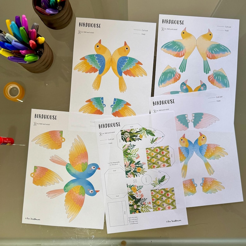 May include: Printable birdhouse craft templates featuring colorful birds with cut-out wings. The templates include instructions to "Cut, fold and stick" and are labeled "Birdhouse".