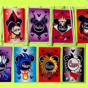 May include: Nine colorful Disney villain character keychains with Mickey Mouse ears. The characters include Ursula, Hades, Scar, Cruella de Vil, Jafar, Maleficent,  Gothiel, and the Evil Queen.