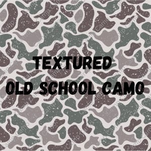 May include: A seamless pattern of textured camouflage in shades of brown, green, and gray. The text "TEXTURED OLD SCHOOL CAMO" is printed in black.