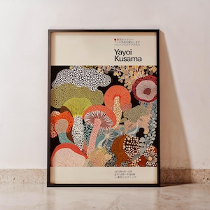 Yayoi Kusama-inspired poster is displayed upright in a black frame and placed on a neutral background for a modern and elegant presentation.