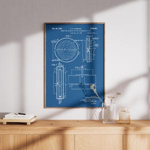 May include: A framed blueprint patent illustration with a blue background and white technical drawings. The patent is dated Feb. 20, 1934, and includes the text "Method and Apparatus for the Acceleration of Ions."