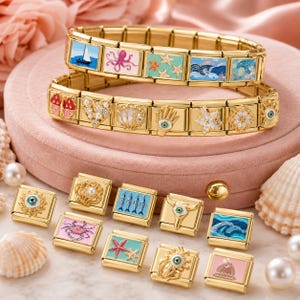 May include: Gold charm bracelets with marine-themed charms, such as a sailboat, octopus, starfish, and waves. Other charms include a heart, seashell, and eye. Several individual charms with similar designs are also displayed.
