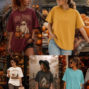 May include: A collection of five short-sleeved t-shirts in various colors including maroon, mustard yellow, cream, charcoal gray, and light blue. Some shirts feature graphic prints of ghosts, pumpkins, and text such as Stay Spooky and Pumpkin Spice.