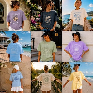 May include: A selection of colourful t-shirts, each with distinct graphic designs and text. Designs include floral patterns, travel locations, and motivational quotes. The shirts are modelled outdoors.