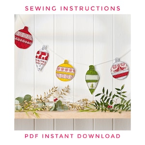 May include: A string of five Christmas ornaments with different patterns and colors, including red, green, yellow, and white. The ornaments are hanging on a white wooden background with a garland of greenery below. The text "SEWING INSTRUCTIONS" is at the top of the image and "PDF INSTANT DOWNLOAD" is at the bottom.