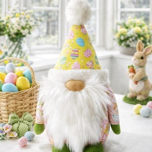 May include: A whimsical Easter gnome with a white beard, a yellow hat patterned with Easter eggs, and a pink floral patterned body. The gnome has green feet and a fluffy white pom-pom on top of its hat. The text "Spring Gnome Sewing Pattern" is at the bottom.
