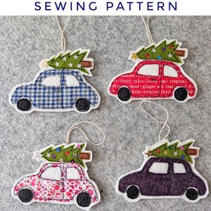 May include: Four felt car ornaments, each with a Christmas tree on top. The cars are in blue houndstooth, red with text, pink floral, and purple. The text "SEWING PATTERN" is at the top.