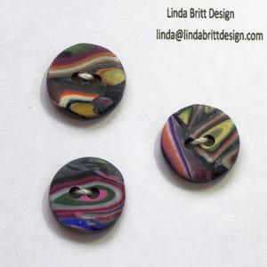 Three Multi-colored Small Fun Buttons