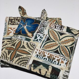 May include: Two brown, green, and blue patterned pot holders with a white background and a stitched border. The pot holders have a loop handle.