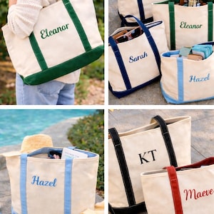 May include: Canvas tote bags in various colors, with names embroidered on them. The bags have colored trim and handles, with names like Eleanor, Sarah, Hazel, KT, and Maeve. The bags are filled with items.