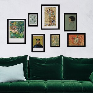 May include: A wall gallery featuring nine framed prints. The prints are a mix of abstract, floral, and landscape designs. The frames are black and the wall is white.