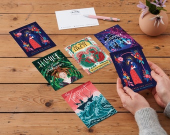 May include: A set of six illustrated postcards featuring Shakespearean plays. The postcards are colorful and feature a variety of illustrations, including a scene from Romeo and Juliet, Hamlet, As You Like It, A Midsummer Night's Dream, The Tempest, and a scene from a play with a title that is not visible in the image.