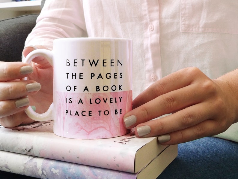 between the pages of a book is a lovely place to be mug
