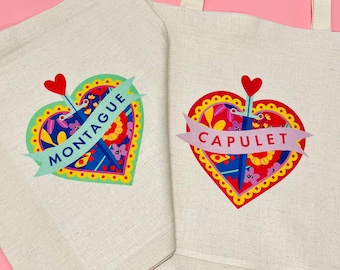 May include: Two white canvas tote bags with colorful heart designs. The left bag has a heart with the text "MONTAGUE" and the right bag has a heart with the text "CAPULET".