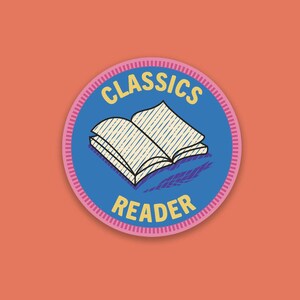 May include: A round patch with a blue center featuring an open book illustration. The words "CLASSICS" and "READER" are in yellow text. The patch has a pink and white striped border, set against an orange background.