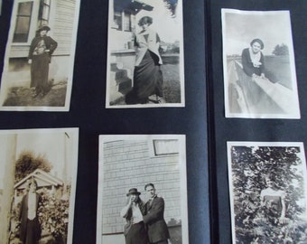 May include: A vintage photo album filled with black and white photographs of people from the early 1900s. The album is open to reveal several photos of people in various poses and settings.