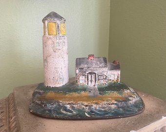 Antique Lighthouse doorstop by National foundry