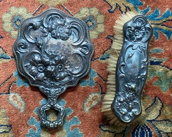 Antique art nouveau Repousse mirror and brush set