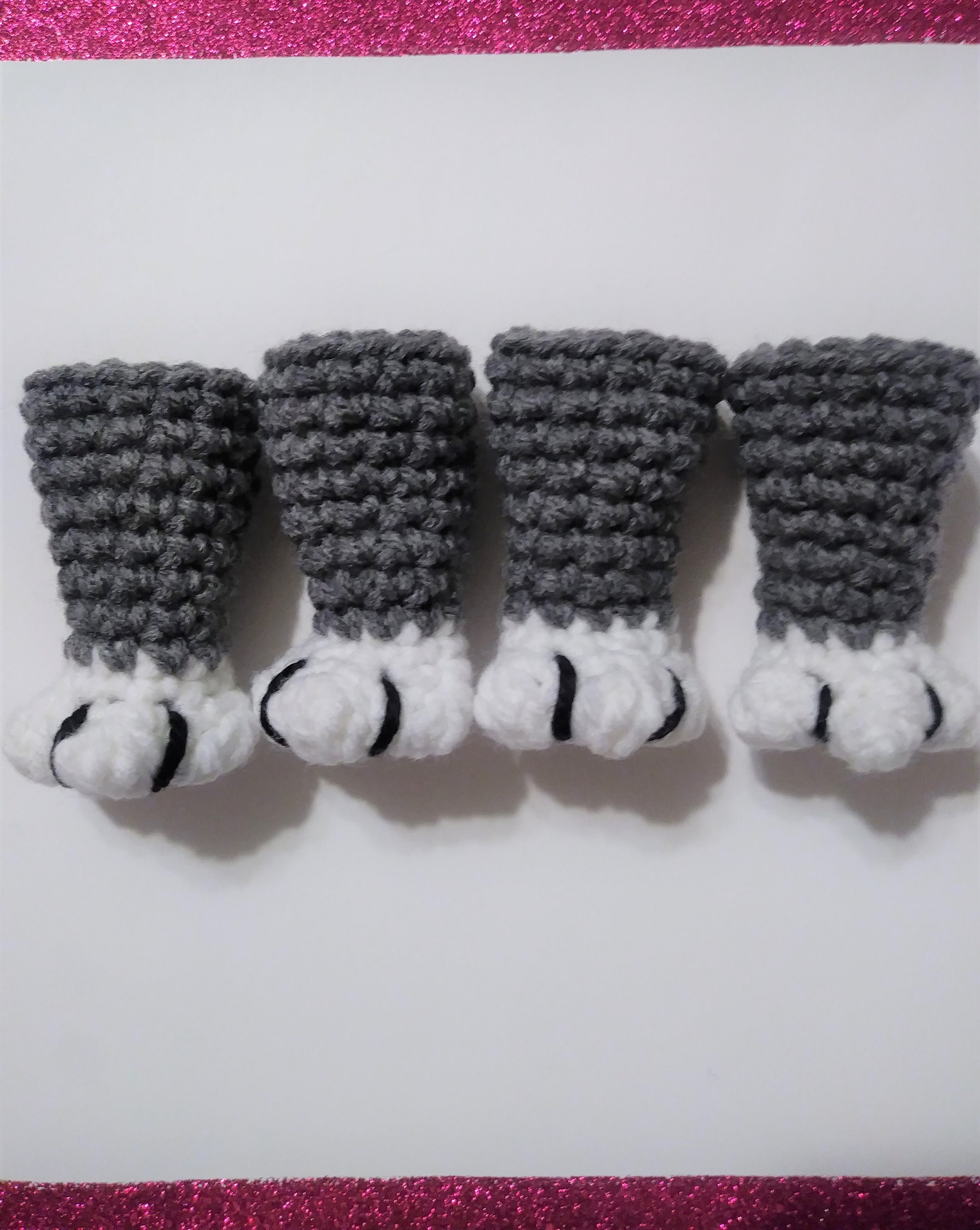 Currently making cat paw chair socks, and I'm dying over how cute