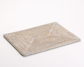 May include: White woven rectangular placemat with a diamond pattern.