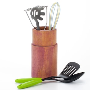 Decorative cutlery stand made of natural wood in vintage style.