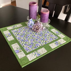 May include: A rustic wooden sign with the text "Welcome to our home" in white lettering. The sign features a distressed finish and a simple, inviting design, perfect for entryway decor.