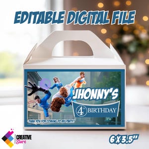 May include: White gable box with a blue and white graphic featuring superhero characters. The box reads "Jhonny's 4th Birthday" and "Thank you for coming to my party!" The box measures 6 x 3.5 inches.