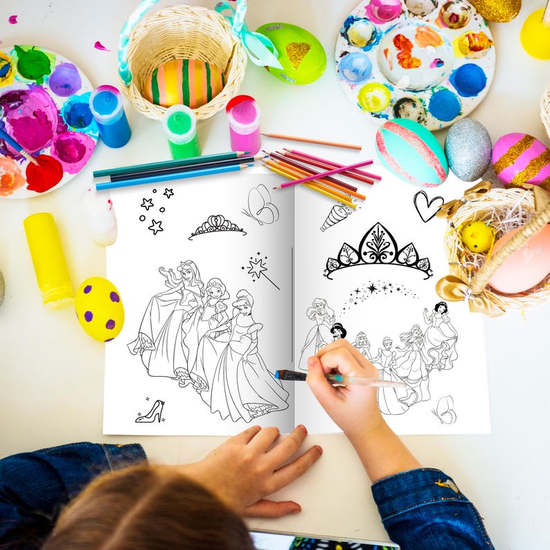 May include: A young person colors a princess-themed coloring book with markers and crayons. The book features illustrations of princesses in gowns and crowns. The book is open to a page with a scene of princesses in a garden.