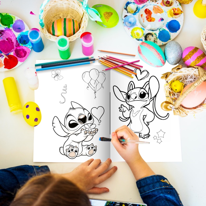 May include: A coloring book open to two pages featuring black and white line drawings of Stitch from Lilo & Stitch. The left page shows Stitch holding a flower and the right page shows Stitch with a heart above its head. A child is coloring the book with a blue marker.