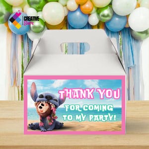 May include: White party favor box with a pink border featuring a cartoon character and the text "THANK YOU FOR COMING TO MY PARTY!". The box has a handle and is decorated with balloons.