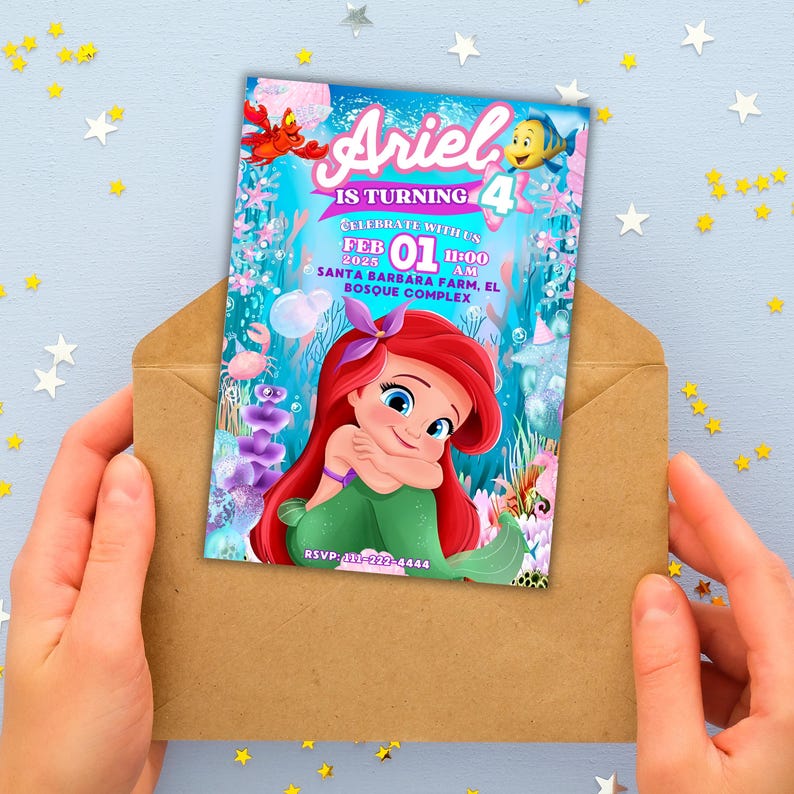 May include: Ariel birthday invitation card featuring the Little Mermaid. The card is held in a brown envelope. The invitation has the text "Ariel is turning 4" and includes the date, time, and location of the party. The card features Ariel, a crab, and a fish.