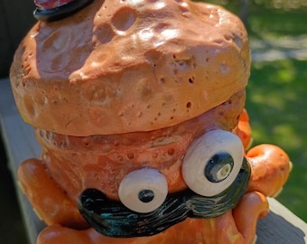 Hand-Sculpted Octopus Jar: Whimsical Orange Clay Character with Mustache, Bowler Hat
