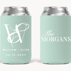 May include: Two mint green can coolers with silver tops. One cooler features a white monogram with the names "William + Elise" and the date "08.12.2027". The other cooler has the text "The Morgans" in white. These are ideal for weddings.