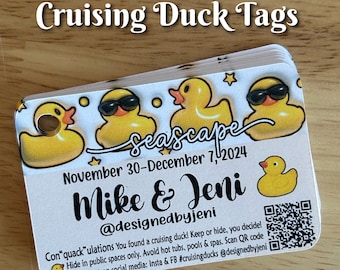 May include: A white card with a yellow rubber ducky design. The card says "Seascape" and "November 30-December 7, 2024". It also says "Mike & Jeni" and "@designedbyjeni". There is a QR code on the card.