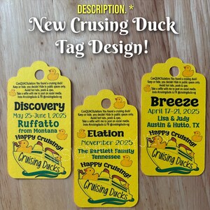 May include: Three yellow rectangular tags with rounded tops and circular holes, each featuring a graphic of a cruise ship and rubber ducks. The text includes "New Crusing Duck Tag Design!" and personalized details like "Discovery," "Elation," and "Breeze."