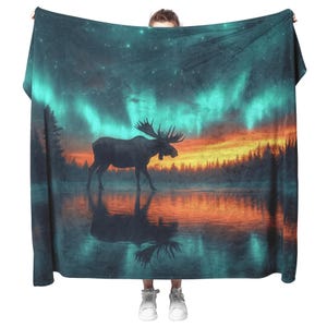 Manta polar Aurora Borealis Moose, reflejo del lago helado